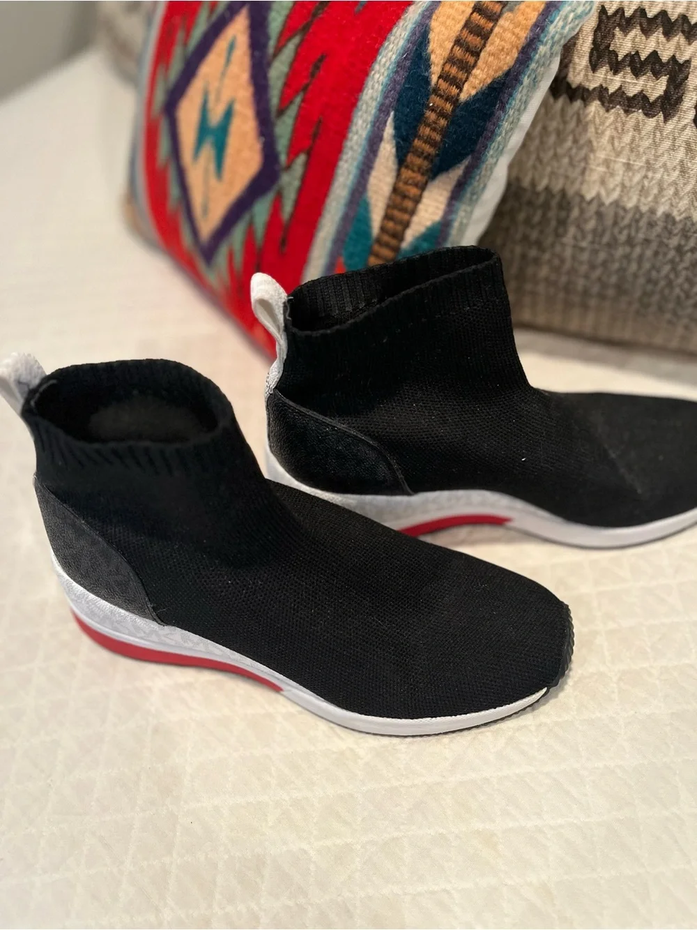 Michael Kors Black Slip-On Knit Sneakers with White and Red Accents